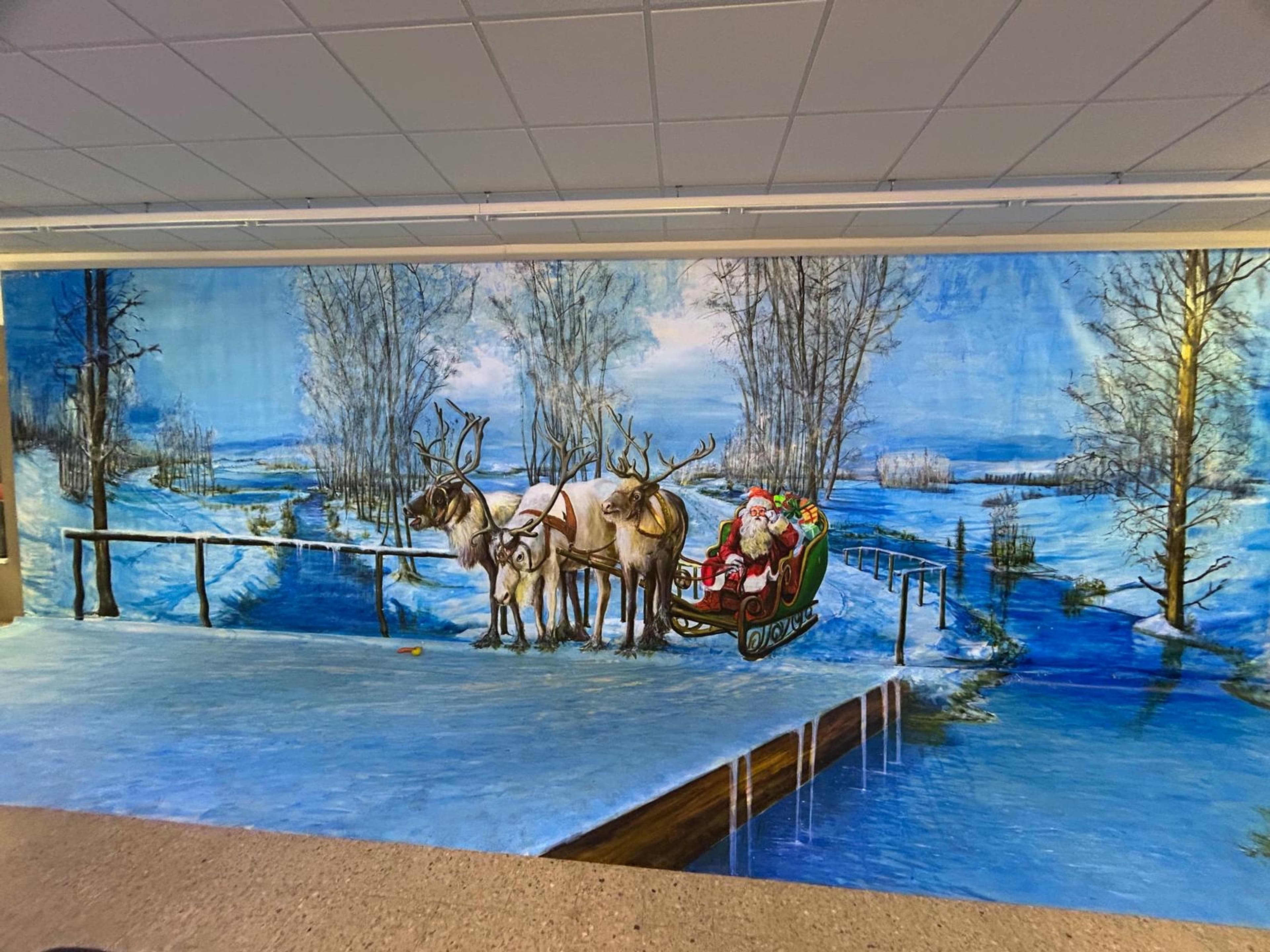 Illusionsmalerei: Winterliche Szene mit Wand- und Bodenbild im Rahmen des Adventszaubers in Wassenberg.